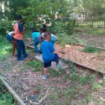 Kids Stop by Community Garden