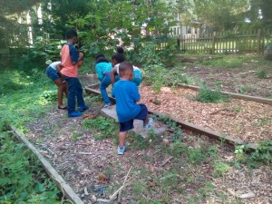 Kids Stop by Community Garden
