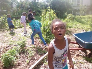 Kids Stop by Community Garden