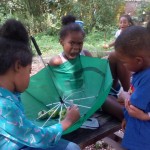 Kids Stop by Community Garden