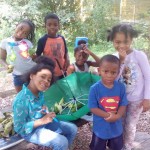 Kids Stop by Community Garden