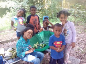 Kids Stop by Community Garden