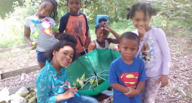 Kids Stop by Community Garden